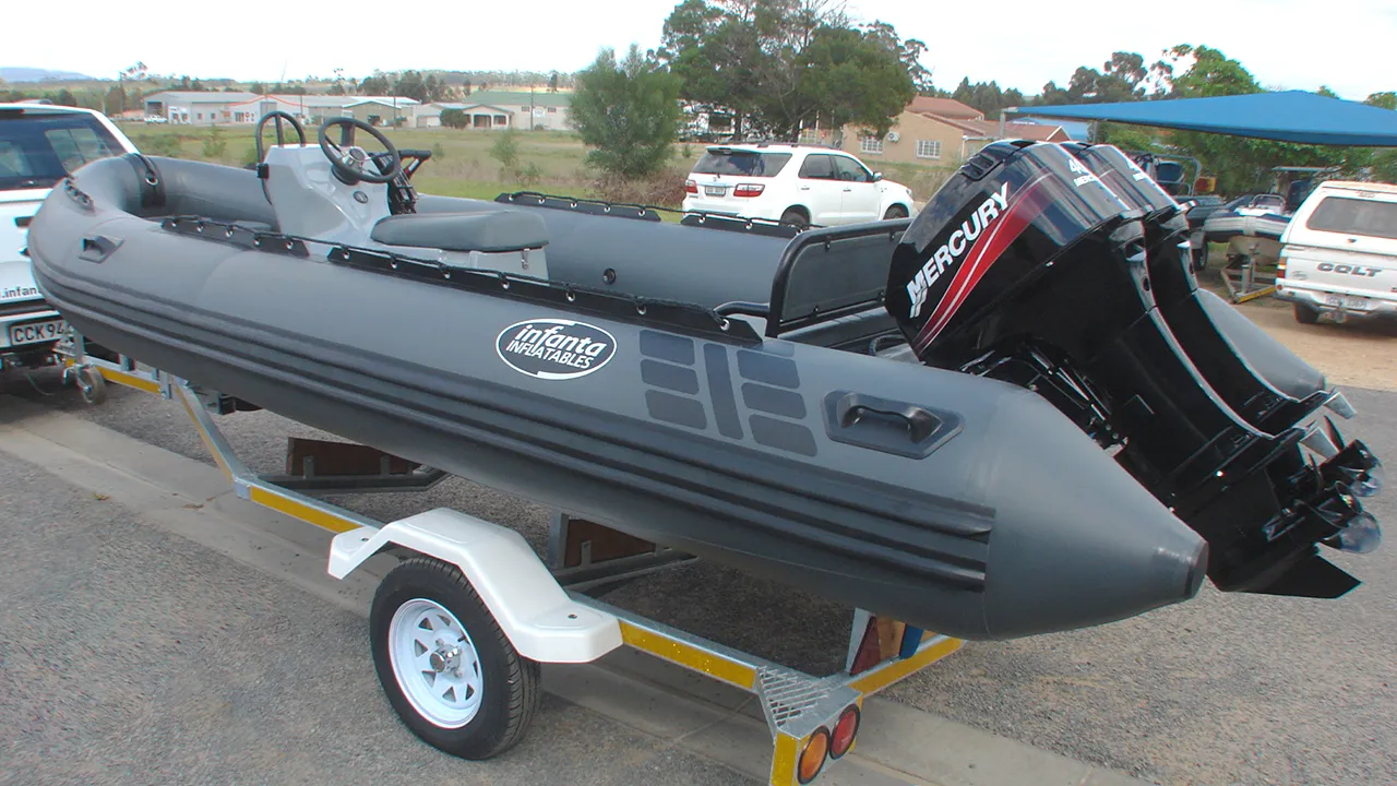 Dark grey inflatable boat on trailer