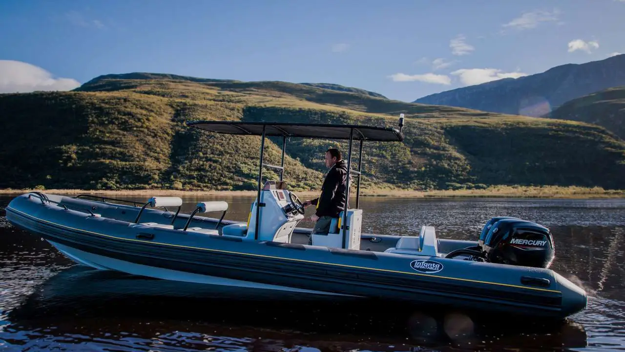 Side view of an inflatable boat lying still on the waters