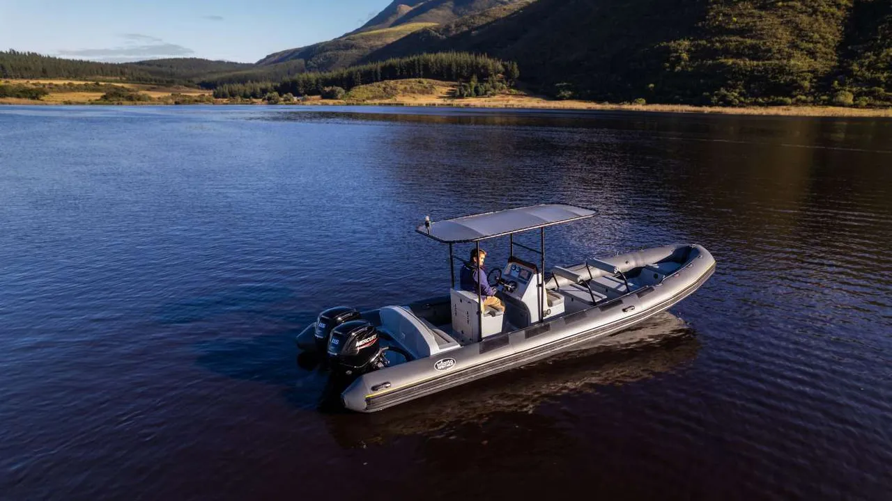 Aerial view of an inflatable boat on dark waters