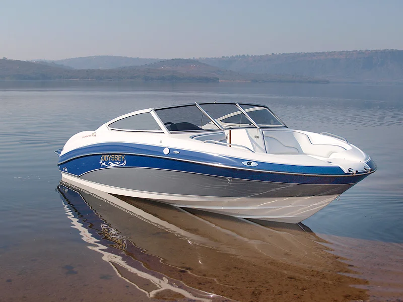 Navy and blue boat on mirror-smooth water