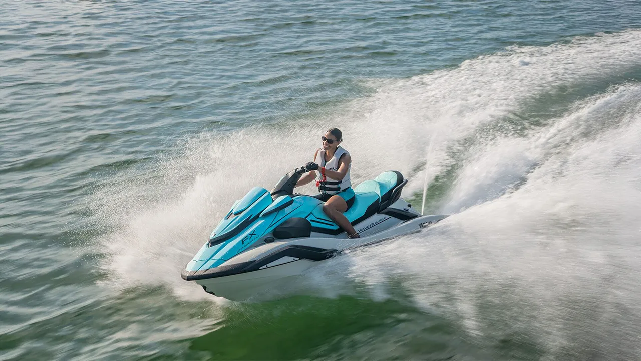 Turquoise and white jet ski on the water