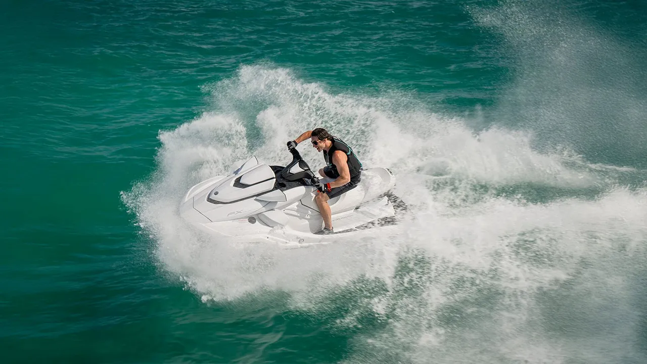 Man racing on a white jet ski