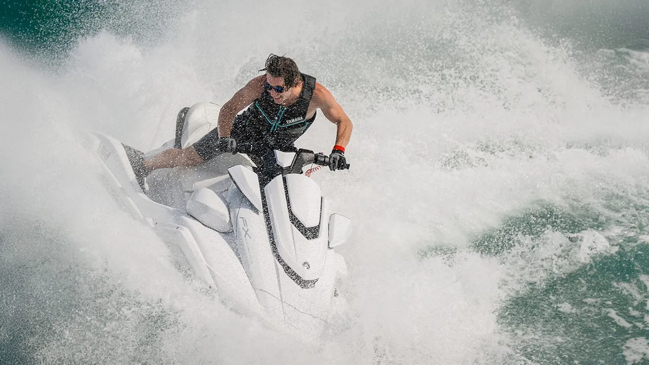 Man racing on a white jet ski