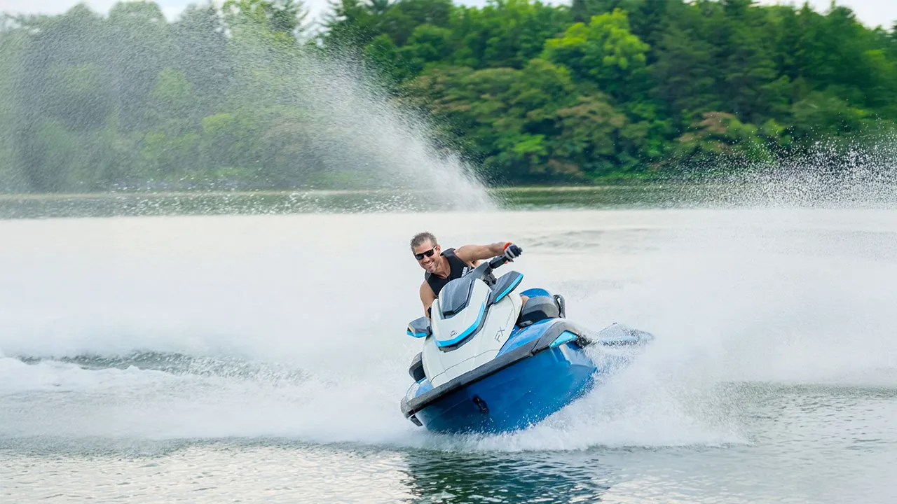 Man riding on a blue jet ski