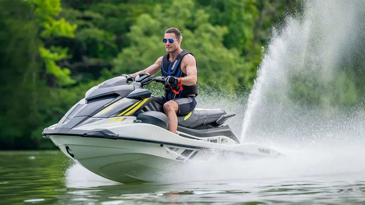 Man riding on a white and black jet ski