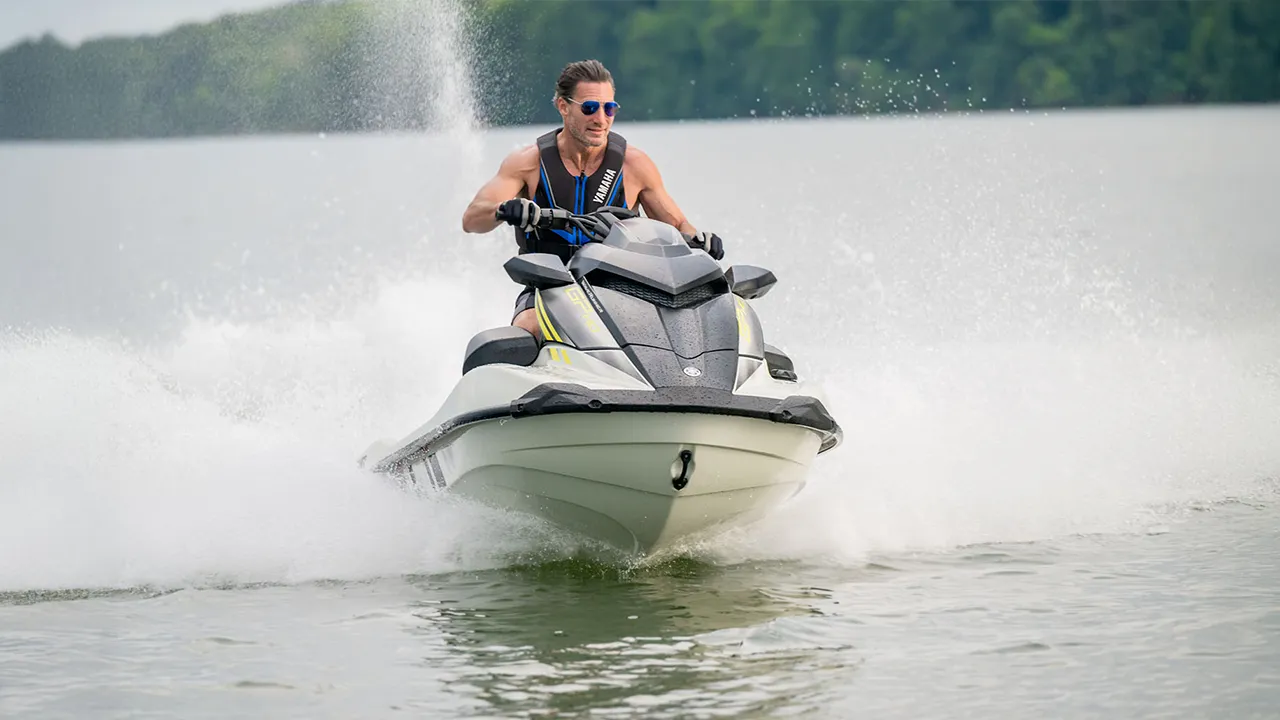 Man riding on a black and white jet ski