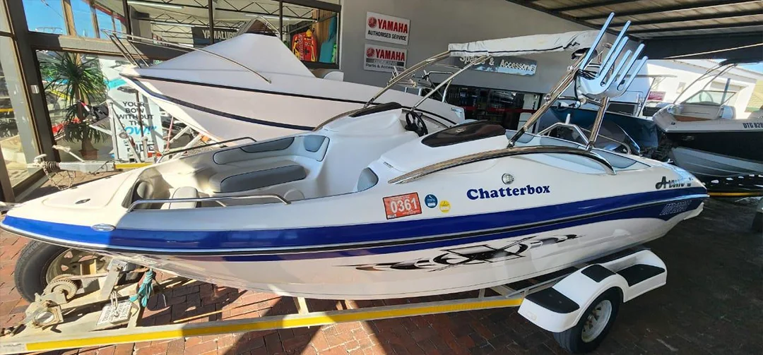 White and blue boat on a trailer